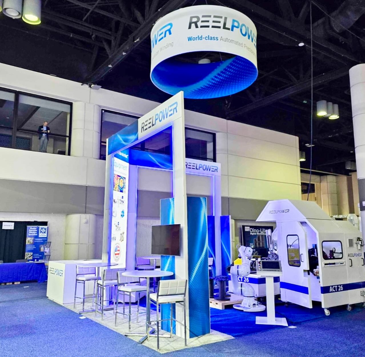 Blue and white ReelPower trade show booth display