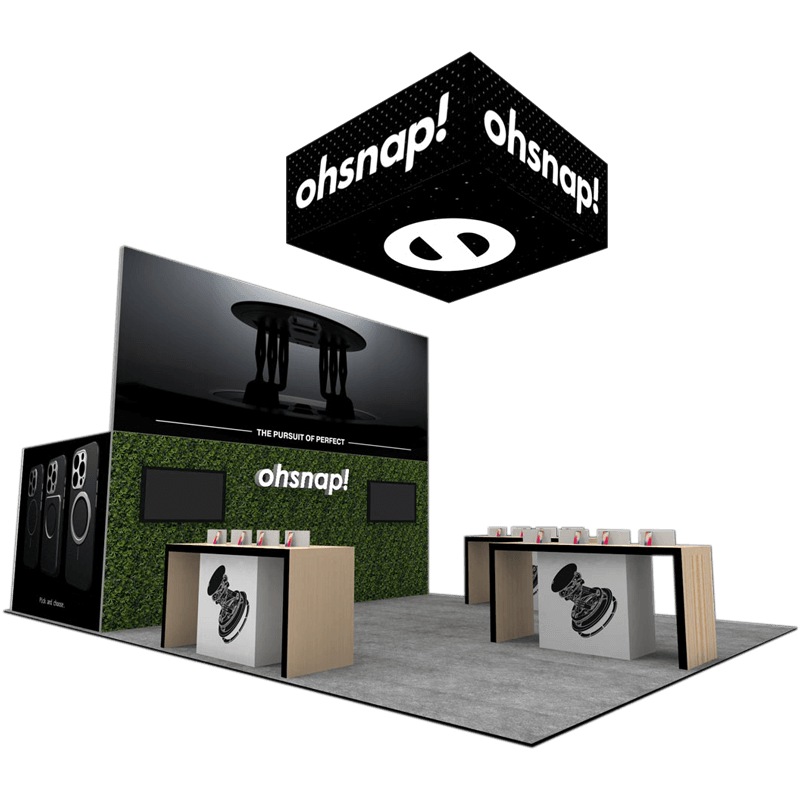 OhSnap 20×30 trade show booth with greenery backdrop and product displays, Orlando, FL