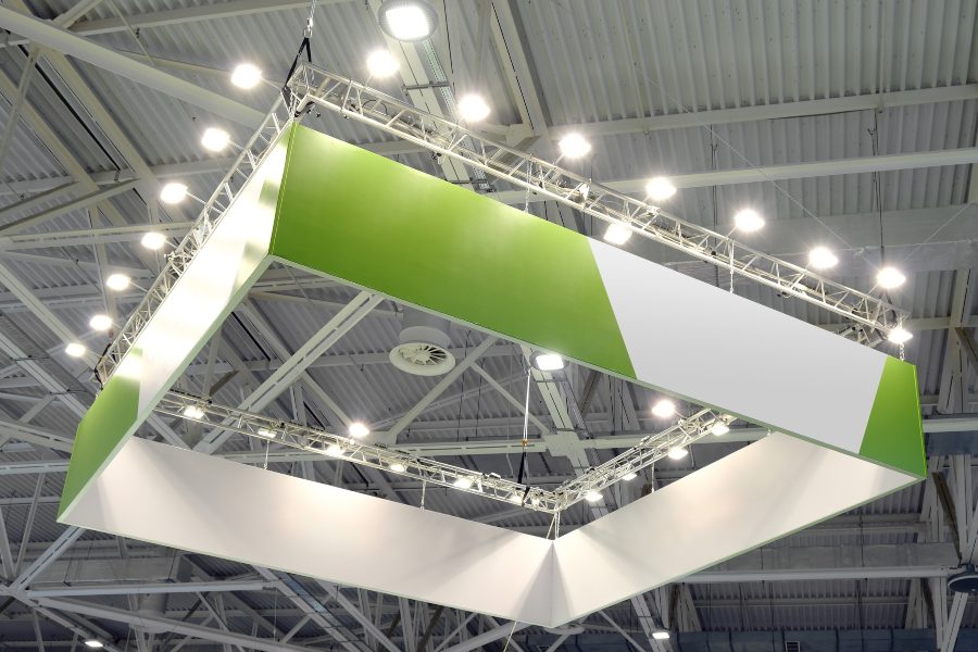 Modular trade show display with backlit hanging advertising
