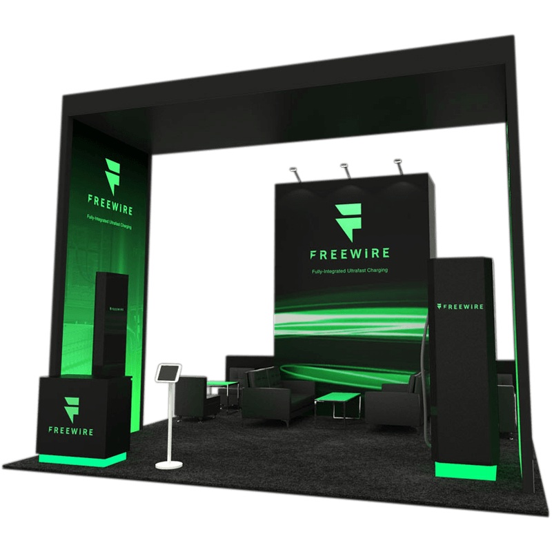 FreeWire 20×20 Booth with sleek green lighting and modern seating in Orlando, FL